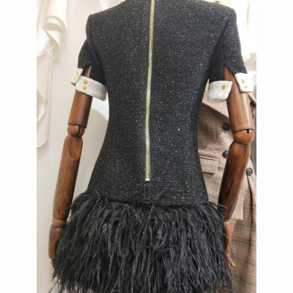 Europe and The United States autumn winter star women fashion metal buckle black and white clash-color hem stitching feather dress